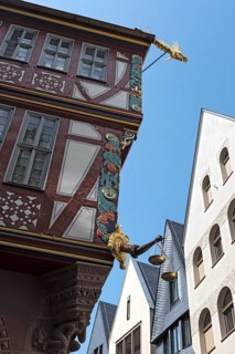 Corner detail of a colorful half timbered house, house to the Golden Libra, in the new historic old