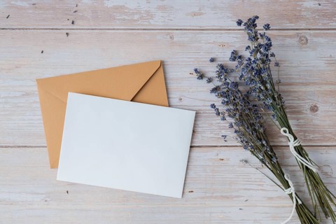 Empty white envelope paper card note template mock up. Copy space for your text. Lavender flower.