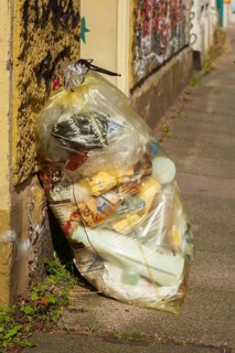 Yellow bag for plastic waste standing on the Bürgergsteig, waste separation, Germany, Europe