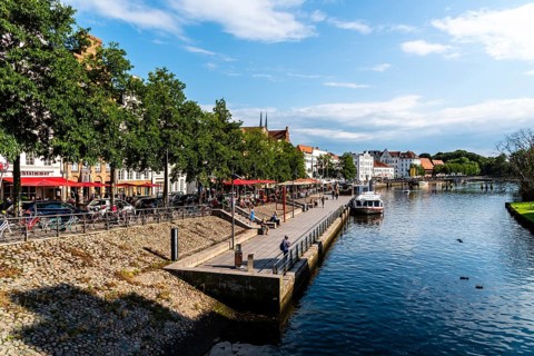 Lubeck, Germany, August 3, 2019: Scenic view of Trave River and waterfront in the old harbour,