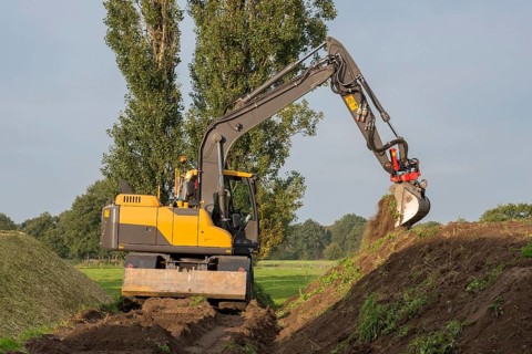 Agriculture shredded corn silage with an excavator in the Netherlands