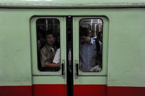 09.08.2012, Pyongyang, North Korea, Asia, Passengers stand in a full underground compartment in