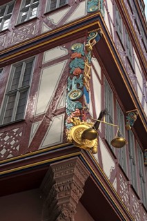 Corner detail of a colorful half timbered house, house to the Golden Libra, in the new historic old