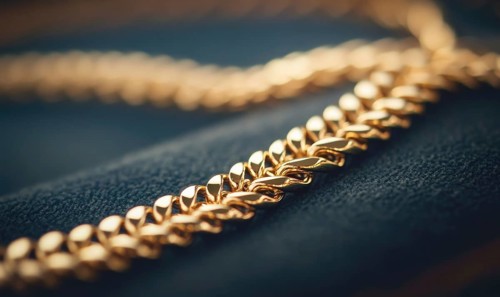 A gold chain necklace with a gold clasp. The necklace is on a black surface AI generated