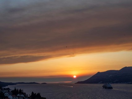 Evening atmosphere at sunset by the sea, view from the bell tower, cruise ship near Korcula,