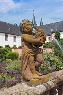Figure sculpture statue in the monastery garden of St. Marcellinus and Peter in Seligenstadt,