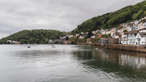 Dartmouth, Devon, England, UK, May 26, 2022: The bank of the River Dart with some boats and the