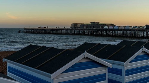 Hastings, East Sussex, England, UK, May 11, 2022: Evening mood on the beach, with some beach huts