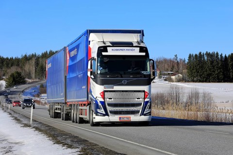 New Volvo FH truck Koskinen Yhtiot pulls freight trailer along highway 52 on a day of spring. Salo,