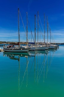 Mahon, Spain, 24 January, 2024: vertical view of moored sailboats in the harbour of Mahon on