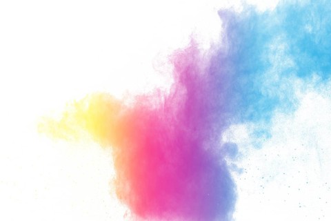 Abstract color powder explosion on white background.Freeze motion of dust splash. Painted Holi in