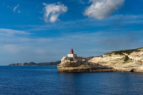 A view of the cliffs of Bonifacio and the Madonetta lighthouse at the harbor entrance