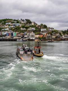 Dartmouth, Devon, England, UK, May 26, 2022: The Lower Ferry crosses the River Dart on its way to