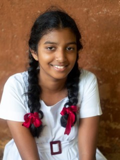 Sinhalese schoolgirl with white clothes, black braids and red ribbons, Sri Lanka, Asia