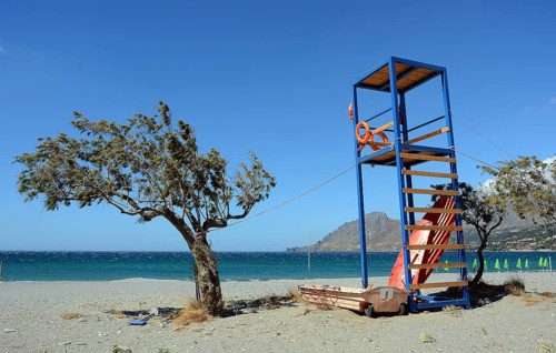 Tamarisk and rescue tower on the beach, Plakias, Crete, Greece, Europe