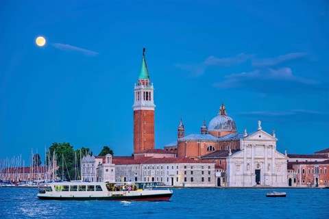 Basilica San Giorgio Maggiore Church with vaporetto waterbus seen across the Venice lagoon with