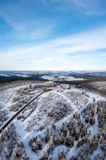 Fichtelberg highest mountain in the Ore Mountains in winter aerial view in Oberwiesenthal, Germany,