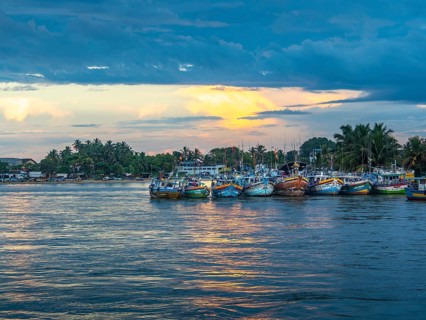 Fishing boats in lagoon, sunset, Negombo, Sri Lanka, Asia