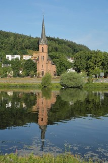 Neo-Gothic Protestant Church in Hirschhorn with Reflection in the Neckar River in Hirschhorn,