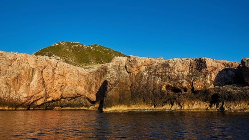 Evening light, Boat tour, View from the sea, Bizarre rock formations, Rugged mountains, Marettimo,