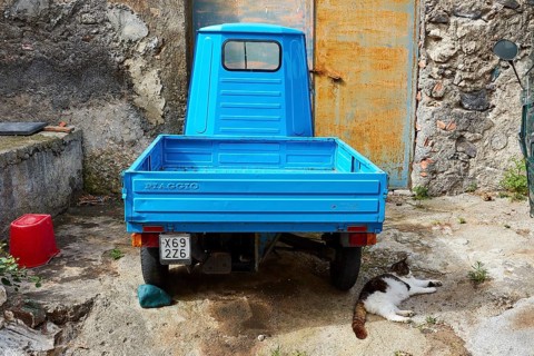 Ape, motorised tricycle, light blue, from behind, yard, Rinella, town on the south coast, Salina,