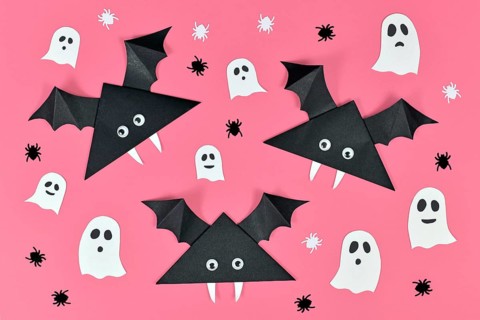 Black paper vampire bats with funny googly eyes and and ghosts and spider shaped confetti on pink