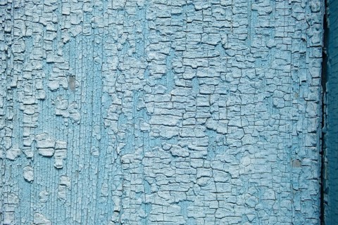 Abstract wooden background. Cracked paint on the wall