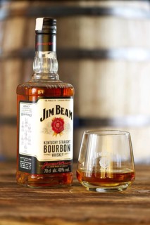 March 28, 2019, Minsk, Belarus, Bottle of kentucky straight bourbon whiskey with glass on wooden