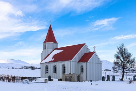 Small church with red roof in the snow, Glaumbaer Museum Village, Northern Iceland Vestra, Iceland,