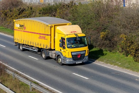 DAF DHL heavy goods vehicle, A12, Suffolk, England, UK