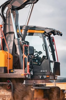 Yellow Volvo tracked excavator on construction site