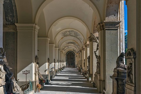 Arcade with tombs at the Monumental Cemetery, Cimitero monumentale di Staglieno), Genoa, Italy,