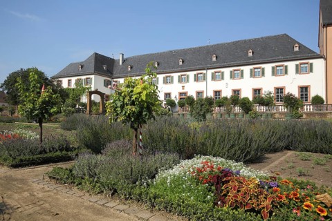 Convent building with garden from the monastery complex, Seligenstadt, Main, Hesse, Germany, Europe