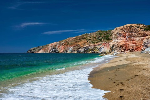 Greek beach in Greece view, Paleochori beach and waves of Aegean sea, Milos island, Cyclades,