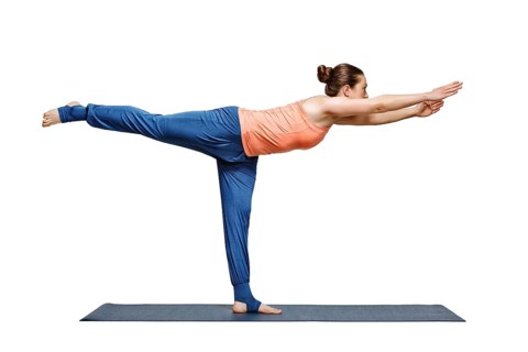 Beautiful sporty fit woman practices yoga asana Virabhadrasana 3, warrior 3 pose isolated on white