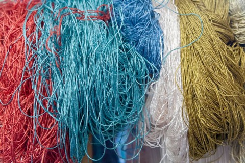 Colourful carpet yarns in a carpet factory, Turkey, Asia