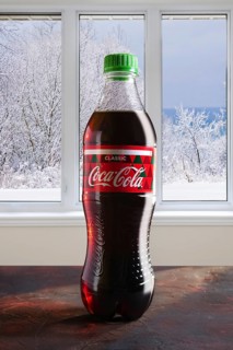 December 7, 2018, Minsk, Belarus, bottle of Coca-Cola on the table with winter view in the window