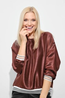 Beautiful happy blonde woman smiling with expression thinking about pleasant things
