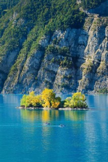 Two kayaks in front of the small chive island in the turquoise waters of Lake Walen, Canton St.