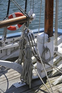 Ropes in wooden blocks, pulleys on board of a sailing ship, Brittany, France, Europe