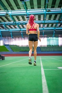 Back view of a sprinter focussing on running fast in the stadium, Glaspalast, Sindelfingen