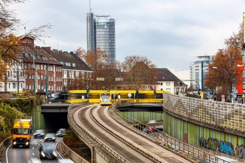 Motorway A40, Ruhrschnellweg, skyline of the city centre of Essen, exit Essen-Huttrop, track bus