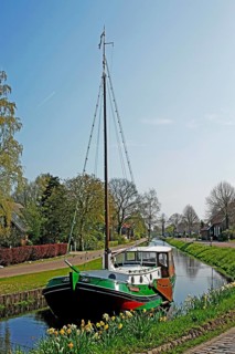Flat-bottomed boat, Großefehn Canal, East Frisia, Germany, Europe