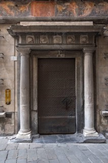 Columns and historical frescoes at the entrance to the former Palazzo Pinelli Parodi in the