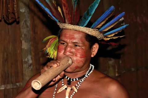 Portrait of an Indian man from the Dessanos tribe with face paintings and wearing a traditional hat