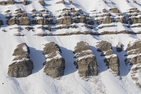Snow covered Carboniferous mountain slope in autumn, Billefjord, Billefjorden, Svalbard,