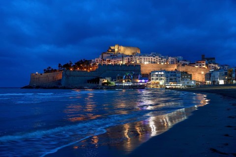 Old town with the Romanesque castle from the 14th century, blue hour, Peñíscola, province