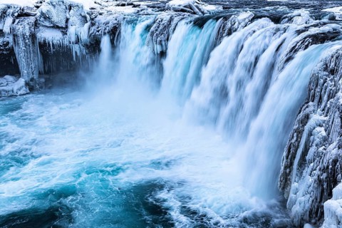 Godafoss waterfall, icy and snowy rock face, Northern Iceland Eyestra, Iceland, Europe
