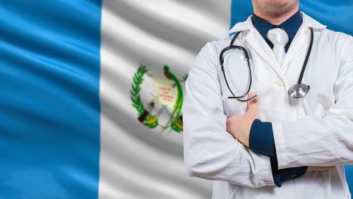 Doctor with stethoscope on guatemala flag. Doctor arms crossed with stethoscope on Guatemala flag,