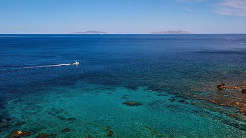 Passing boat, green sea, blue sea, Favignana, Levanzo, Marettimo, Egadi Islands, Sicily, Italy,